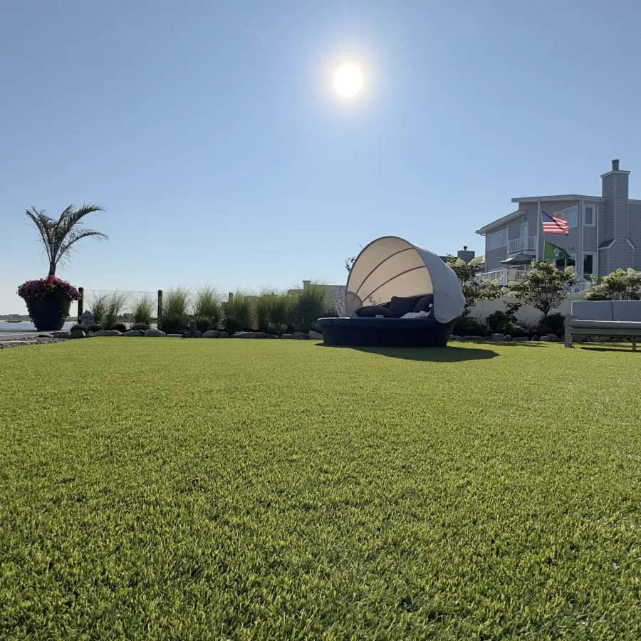 a grassy area with a structure in the back