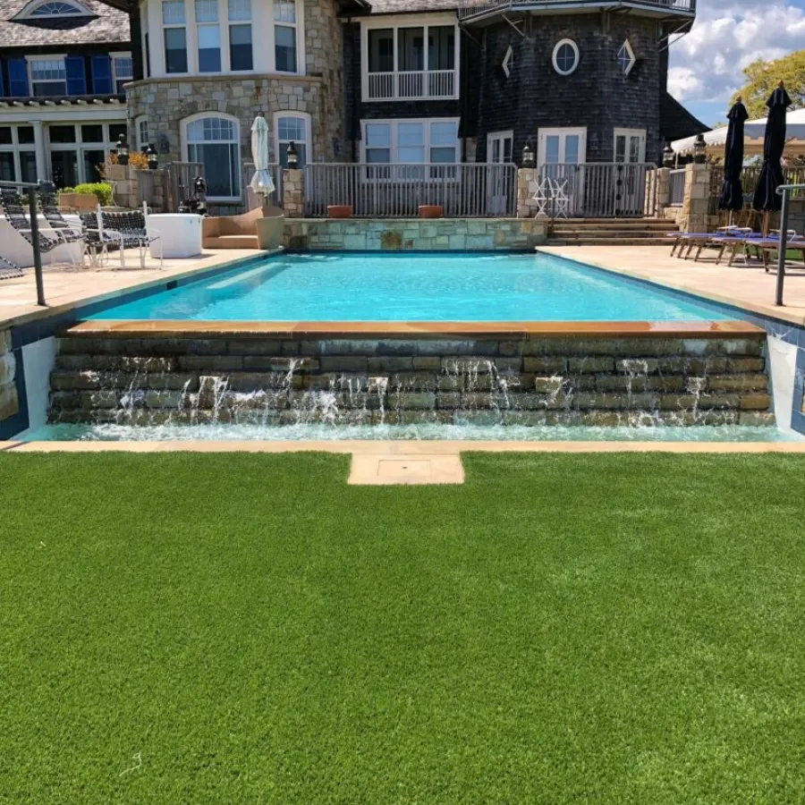 a large building with a pool in front of it