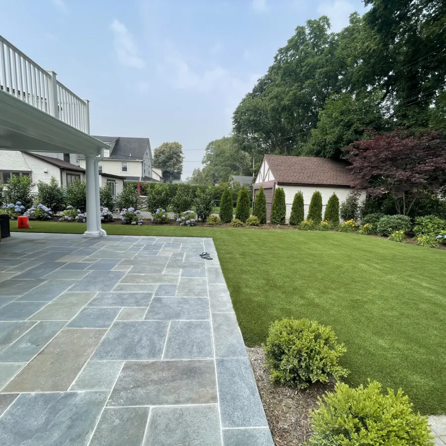 a courtyard with a building and trees