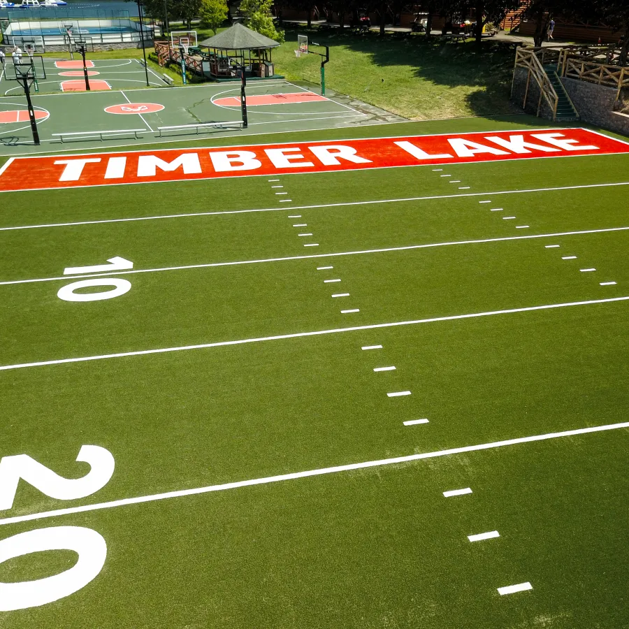 a football field with a crowd watching