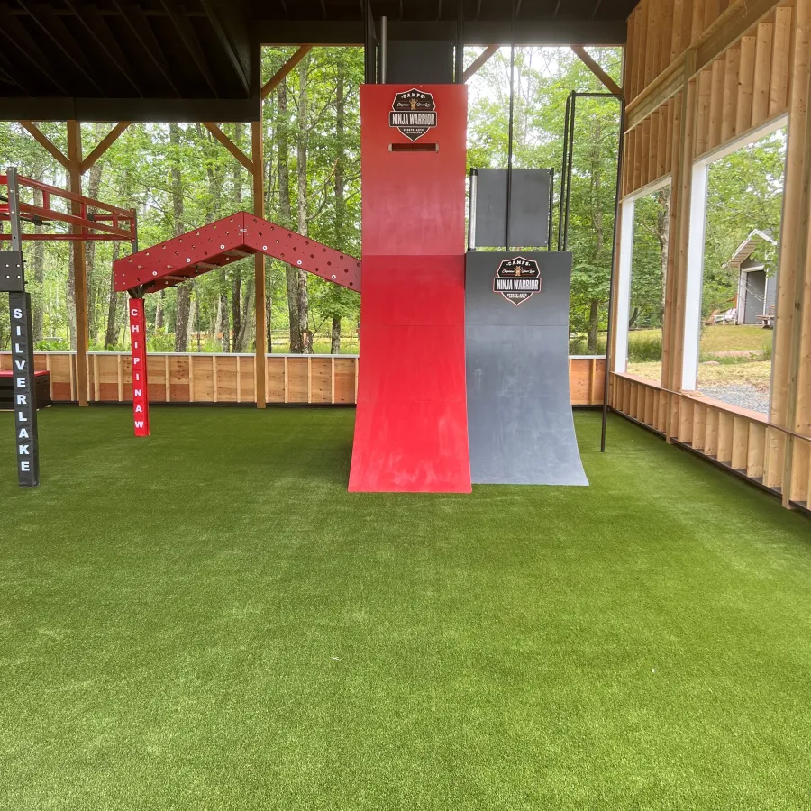 a red pole in a grass field