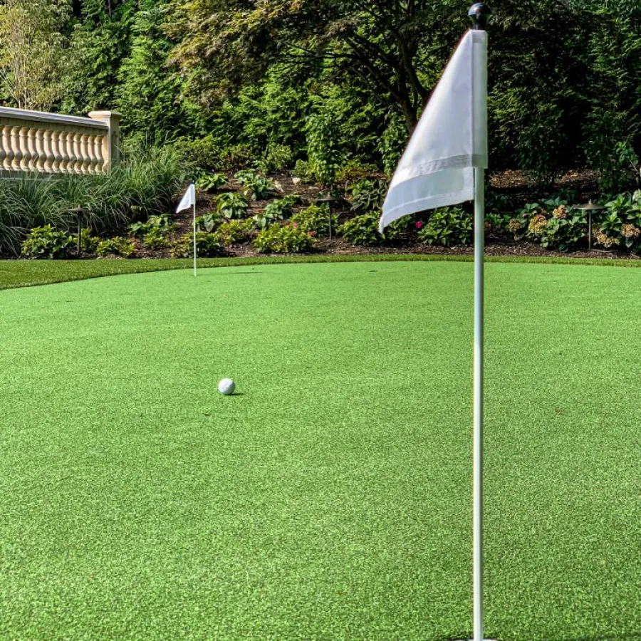 a golf ball on a green golf course