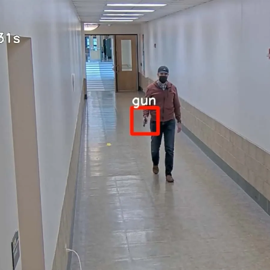a person detected with a gun by a visual weapons detection system