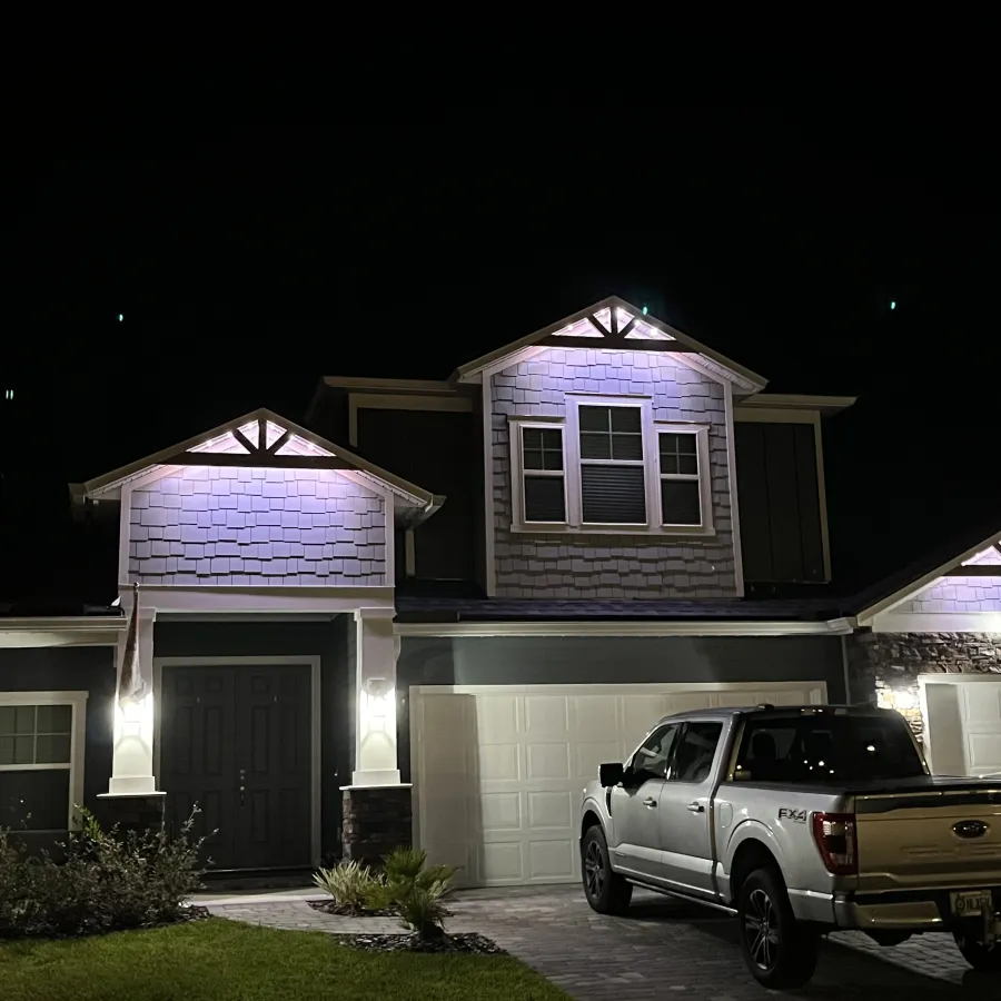 a house with a garage and a car parked in front