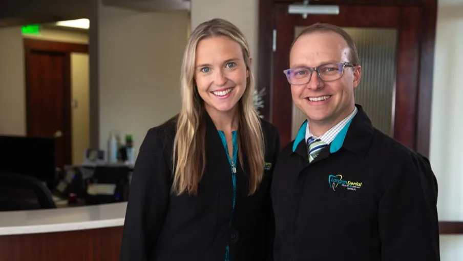 a man and a woman smiling