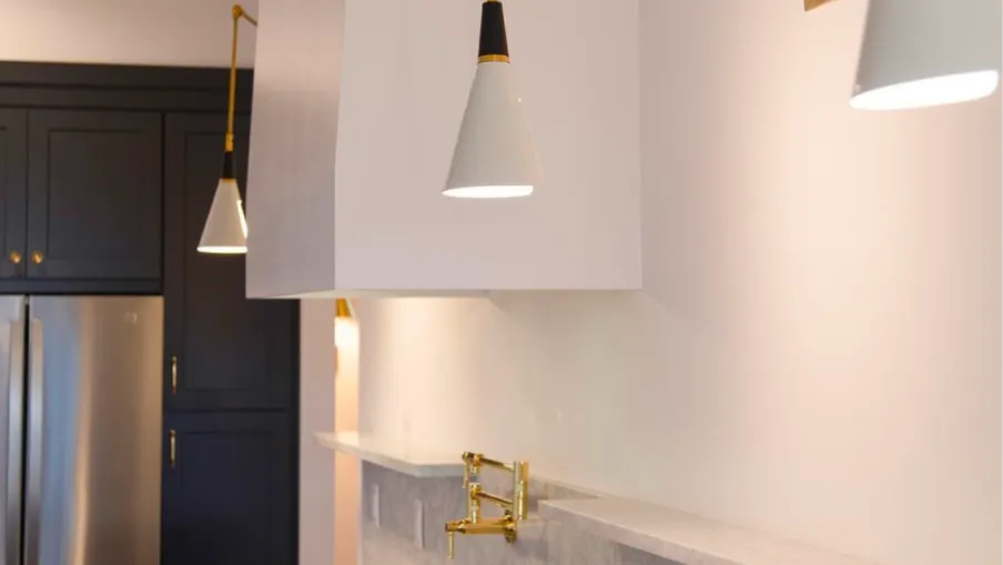 a kitchen with a bar and a bar stool