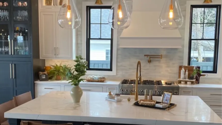 a kitchen with a large white table