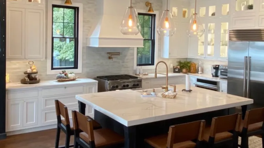 a kitchen with a table and chairs