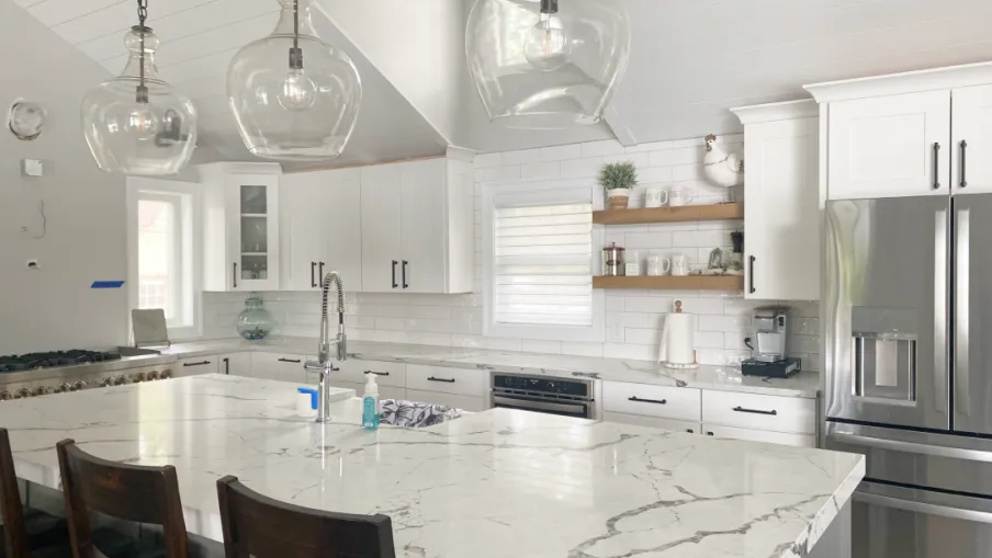 a kitchen with a table and chairs