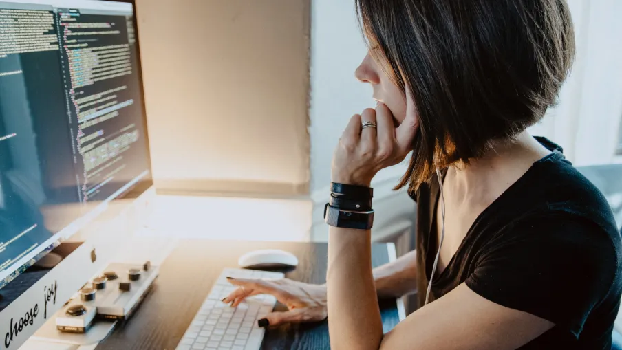a woman sitting at a computer