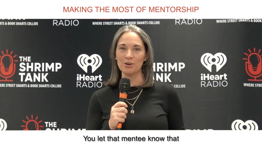 a woman speaking into a microphone