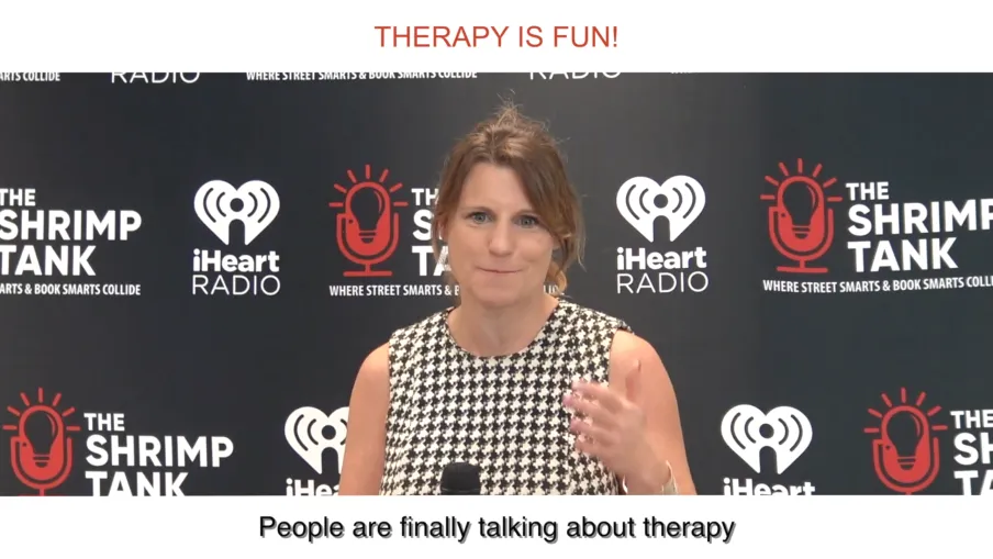 a woman speaking into a microphone