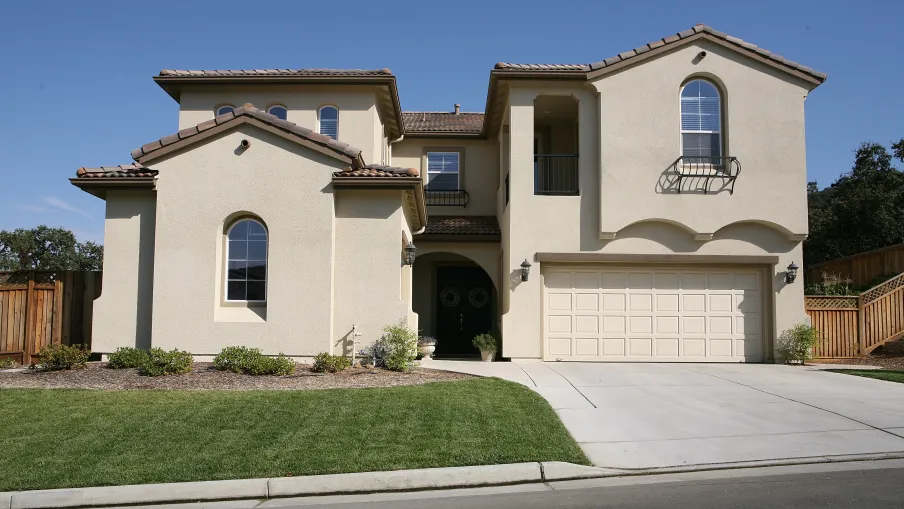 a white house with a driveway