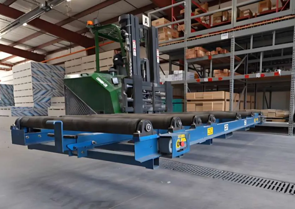 Blue industrial conveyor system with rollers in a warehouse next to green forklift and shelving units.