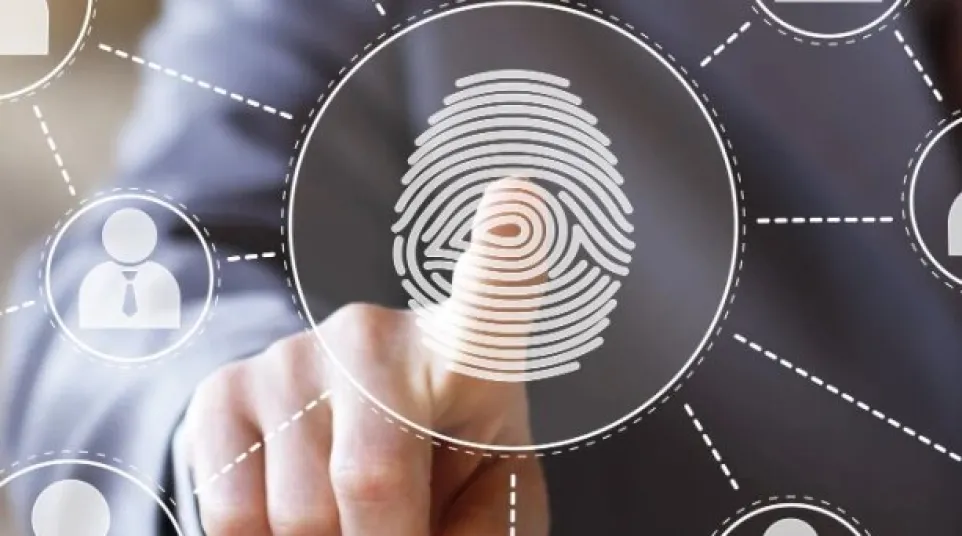 Businessman touching a digital fingerprint icon connected to multiple user icons in a network interface.