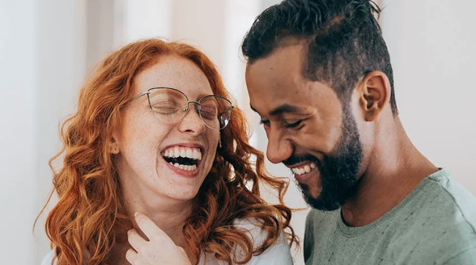 a man and a woman laughing