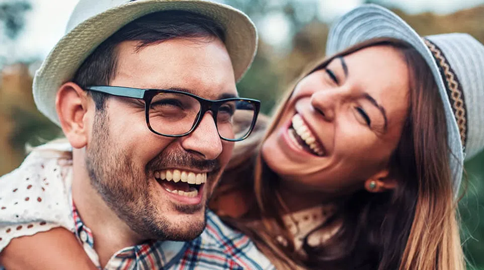 a man and woman smiling