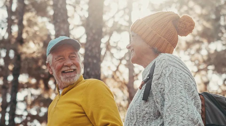 a woman smiling with her hand on her chin