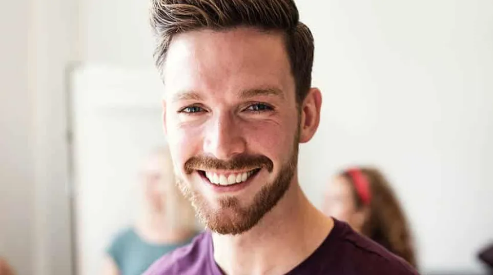a man smiling for the camera