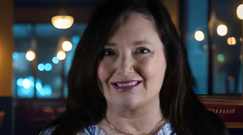 a woman smiling for the camera