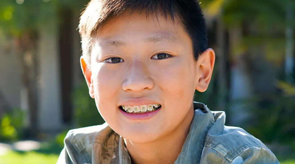 a boy smiling for the camera