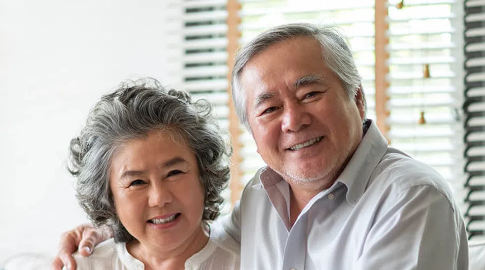 a man and a woman smiling