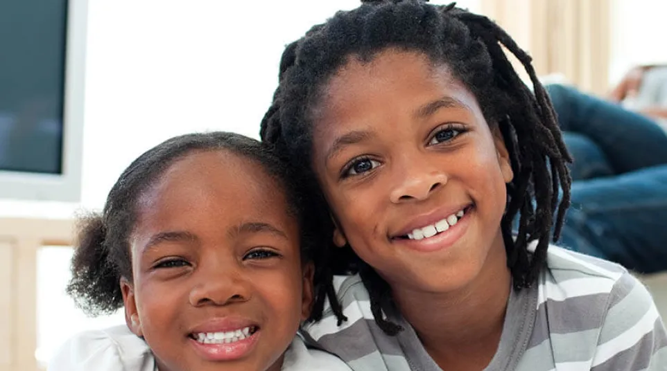 a person and a child smiling