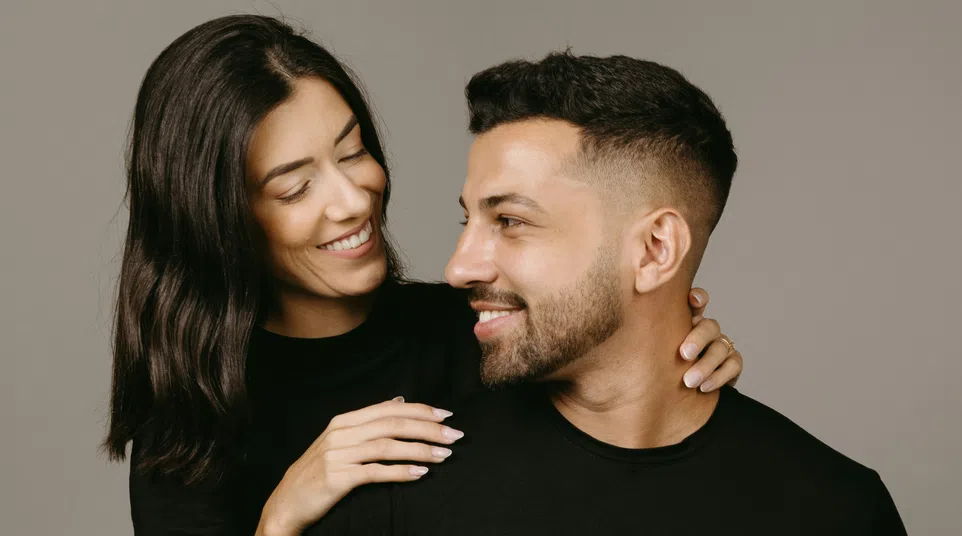 a family smiling and laughing