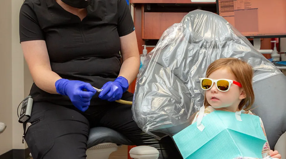 a dentist looking at a patient