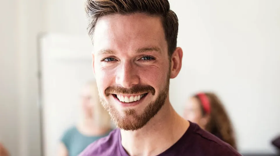 a man smiling for the camera