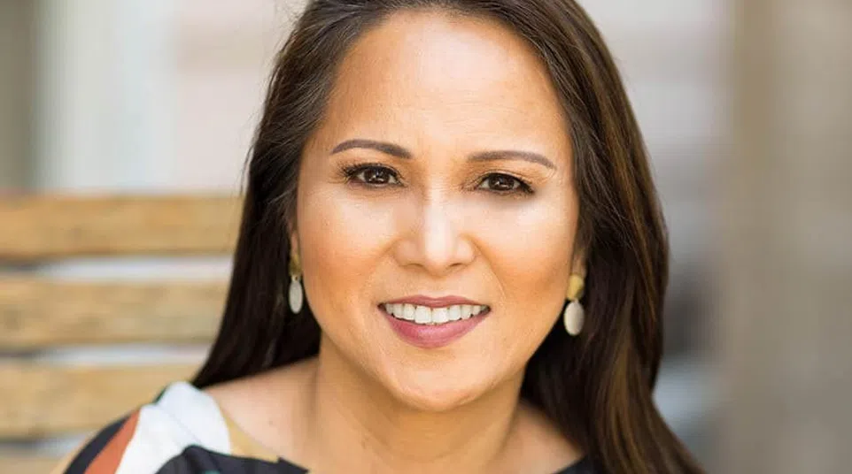 a woman smiling for the camera