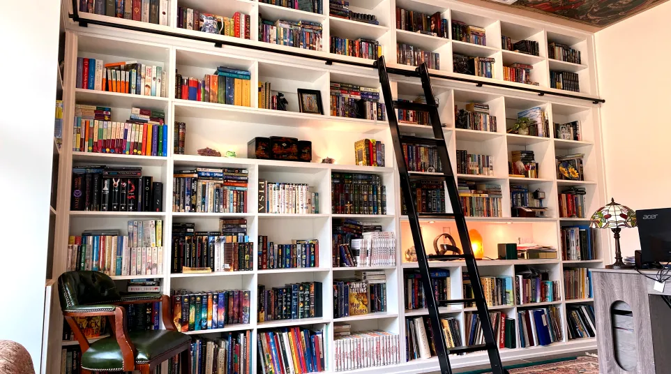 a large book shelf with many books