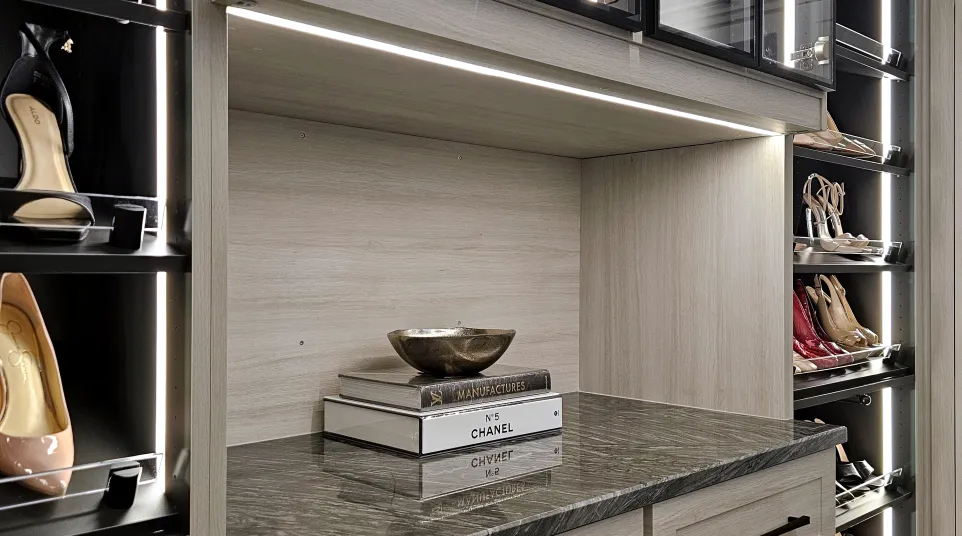 a kitchen with a shelf and a glass cabinet