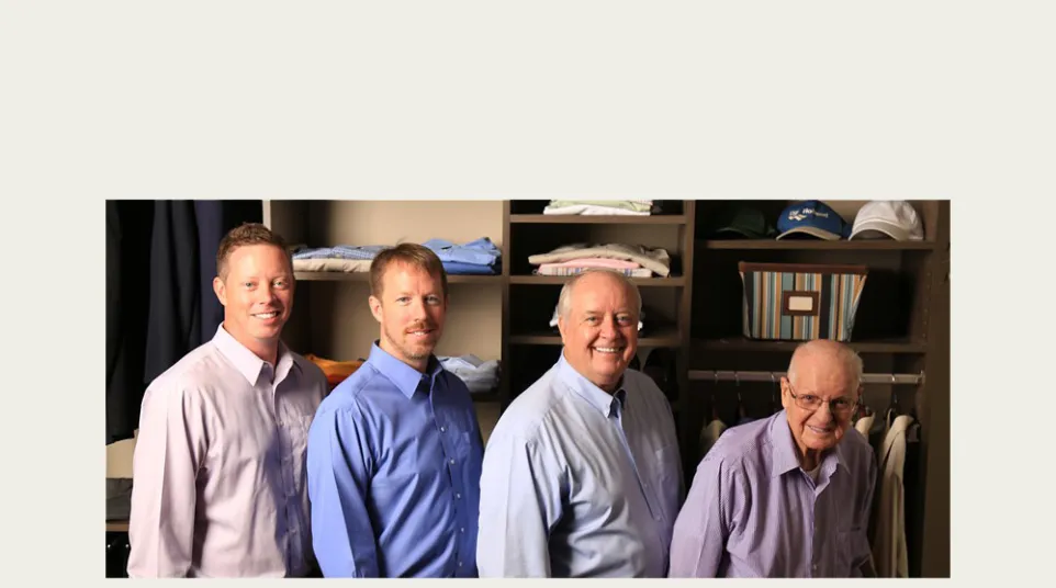 a group of men posing for a photo