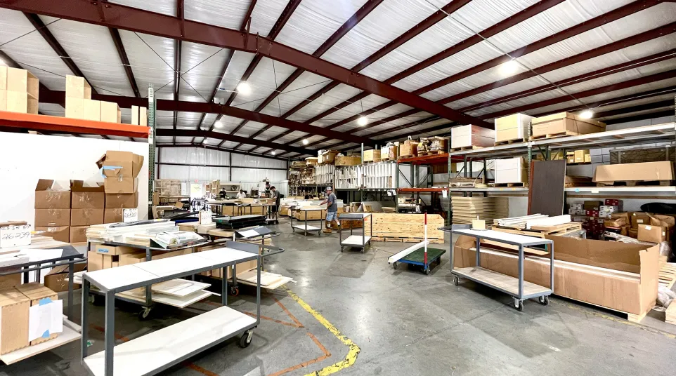 a warehouse with tables and chairs