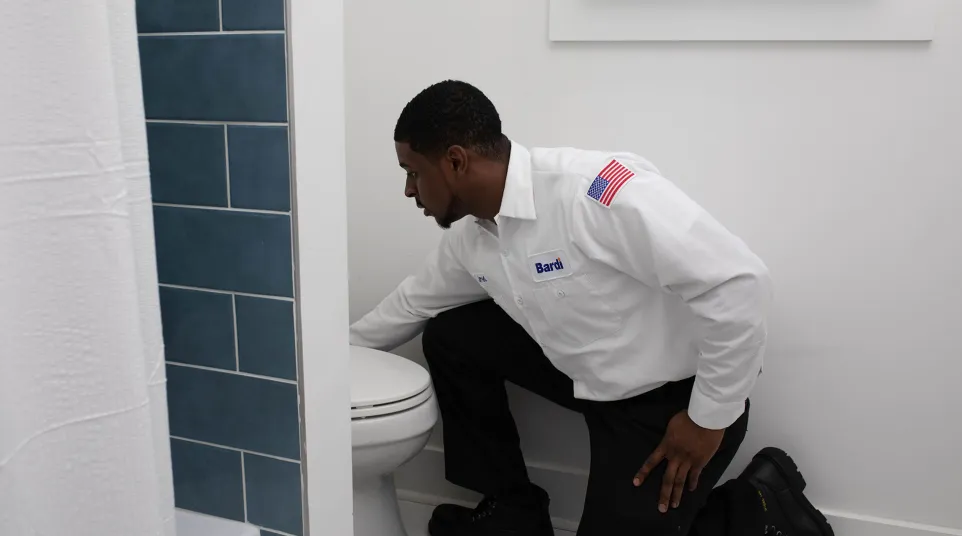 a man sitting on a toilet