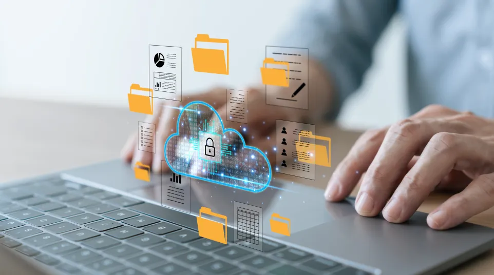 Hands typing on laptop with secure cloud storage and digital folders icons floating above keyboard.
