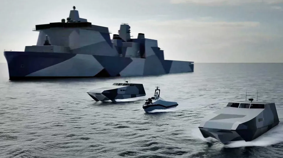 Four camouflaged naval ships including a large destroyer and three smaller vessels on calm sea under a cloudy sky.