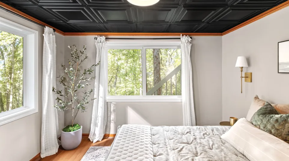 a bedroom with a large window