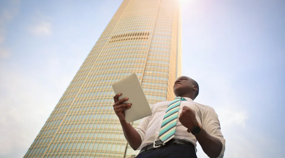 a man holding a laptop