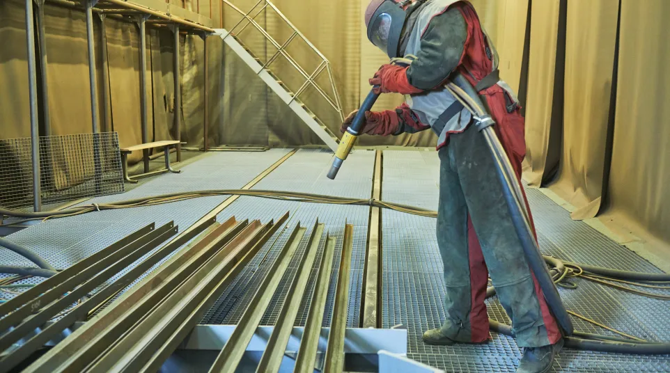 a person wearing a protective gear working on a roof