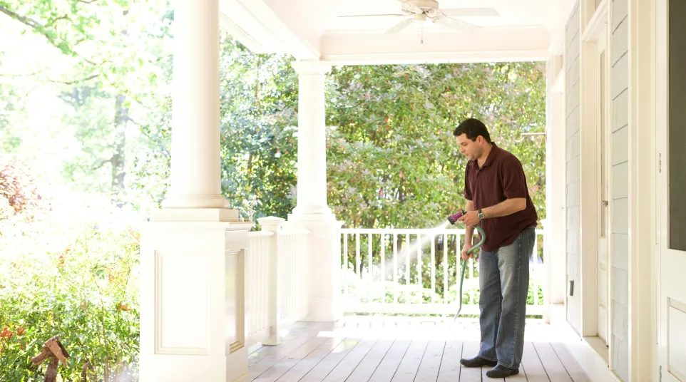 a man standing on a porch