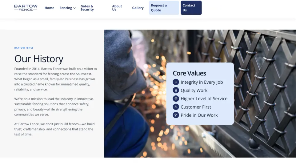 Welder in blue protective gear sparks metal fence components, illustrating craftsmanship and safety in fencing work.