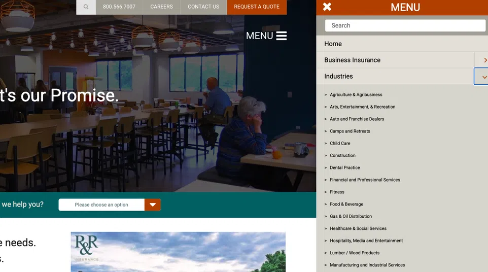 Modern cafeteria with wooden tables and chairs, ambient lighting, and people seated by large windows.