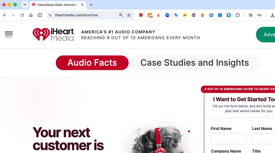 Woman wearing red headphones listening, promoting iHeartMedia's audio advertising reach to 9 out of 10 Americans.