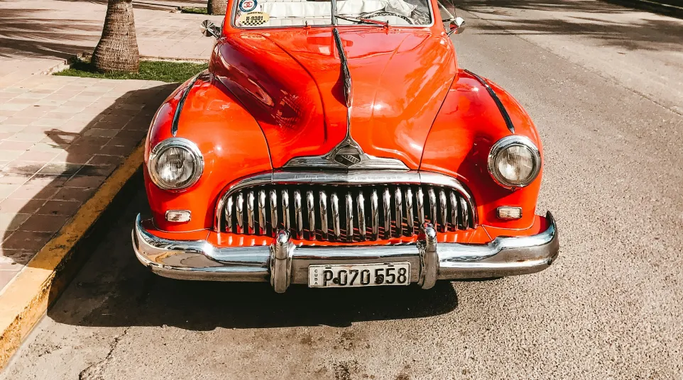 a red car parked on a road