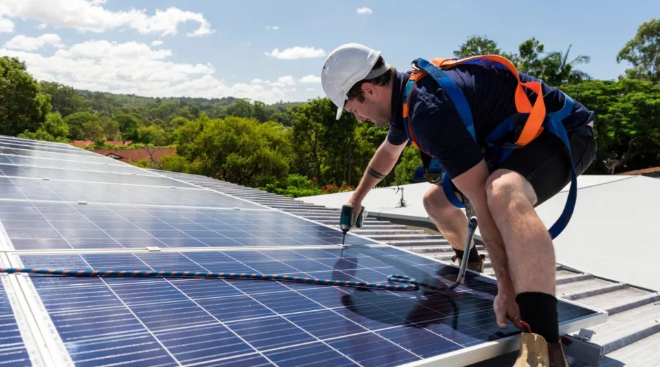 a man working on a solar panel