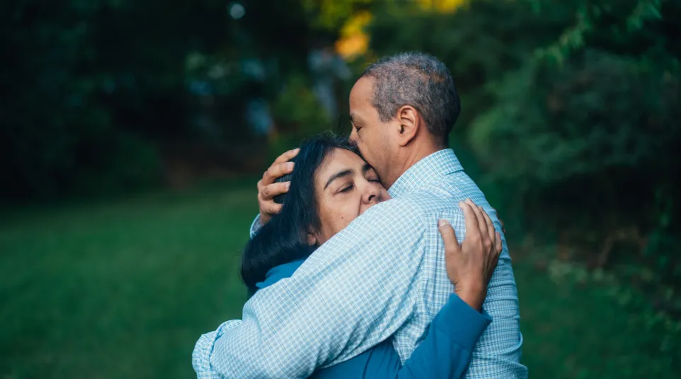 a man and woman hugging