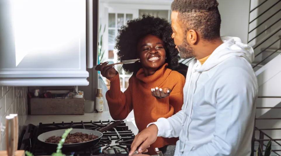 a man and a woman cooking