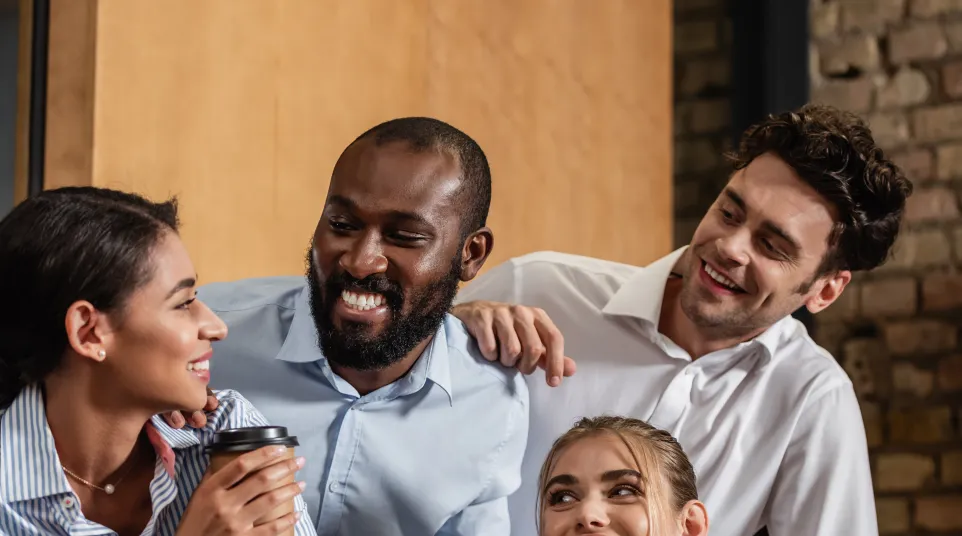 Diverse professionals enjoying a brainstorming session in a modern office environment.